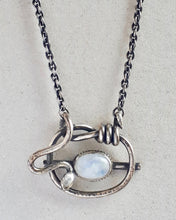 Load image into Gallery viewer, Close up of a sterling silver necklace featuring a moonstone.
