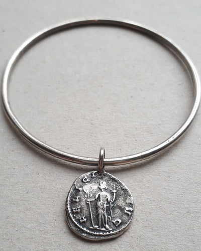 Oxidized sterling silver bangle featuing an ancient Roman coin Felicitas, the goddess of luck and prosperity.